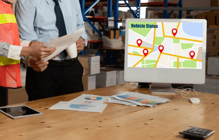 Vehicle tracking software displayed on desktop in company