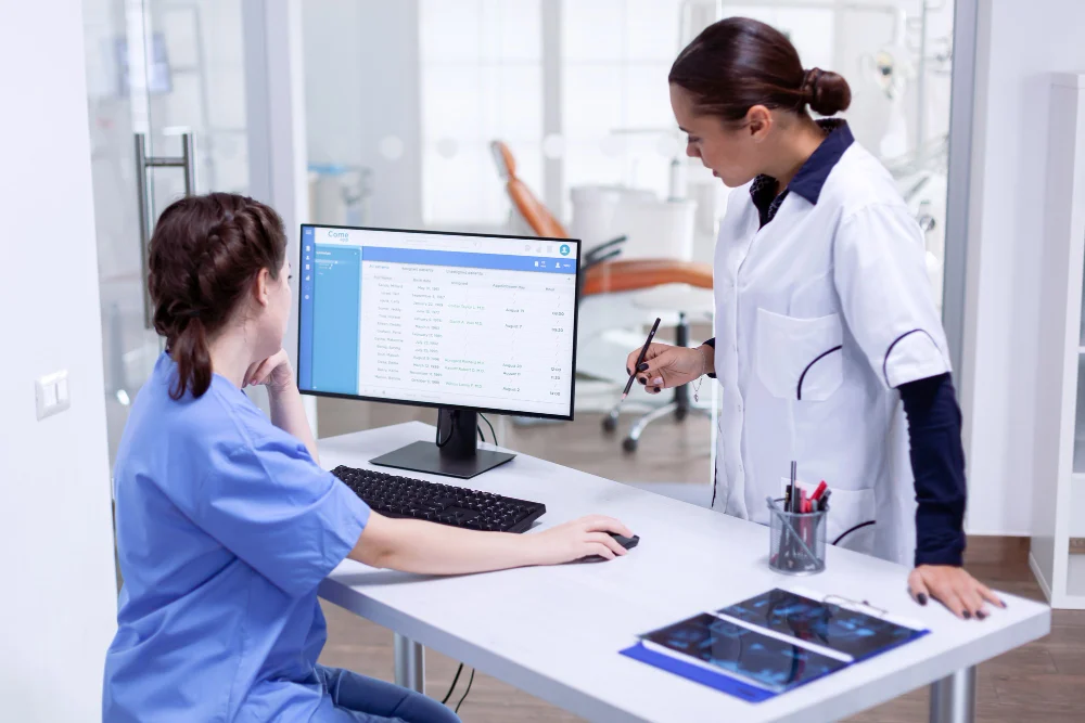 hospital staff works on healthcare desk software