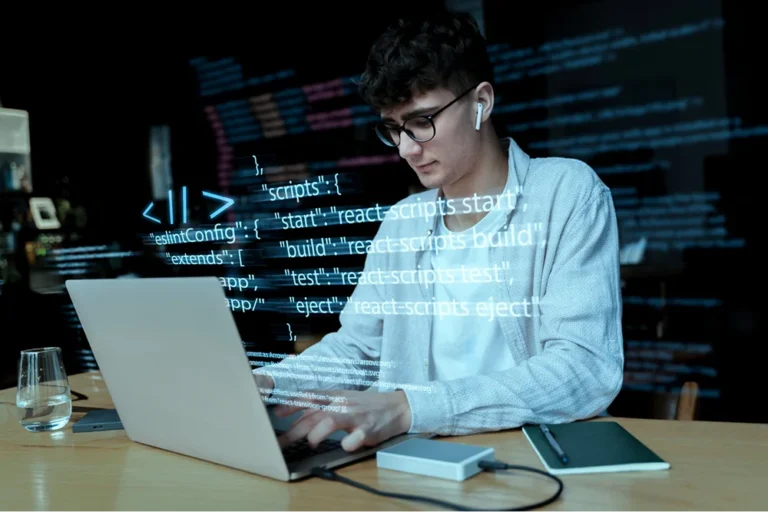 dedicated developer coding on laptop
